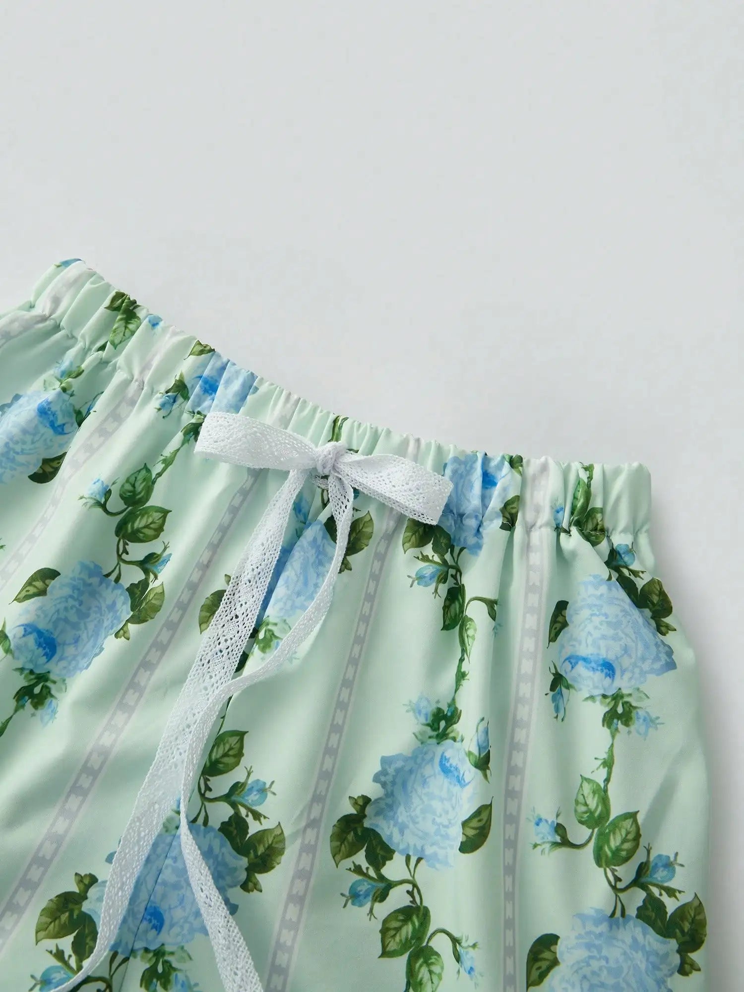 Floral Sleeveless Smocked Pajama Set with Tie Shoulders and Ruffle Shorts Loungewear